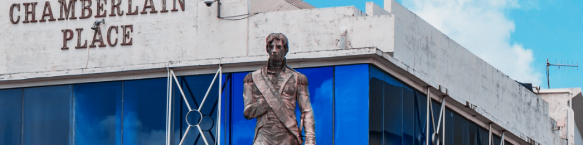 Statue of Lord Nelson with metal railings around it in Barbados