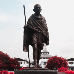 Statue of Mahatma Gandhi with staff in front of University of Ghana