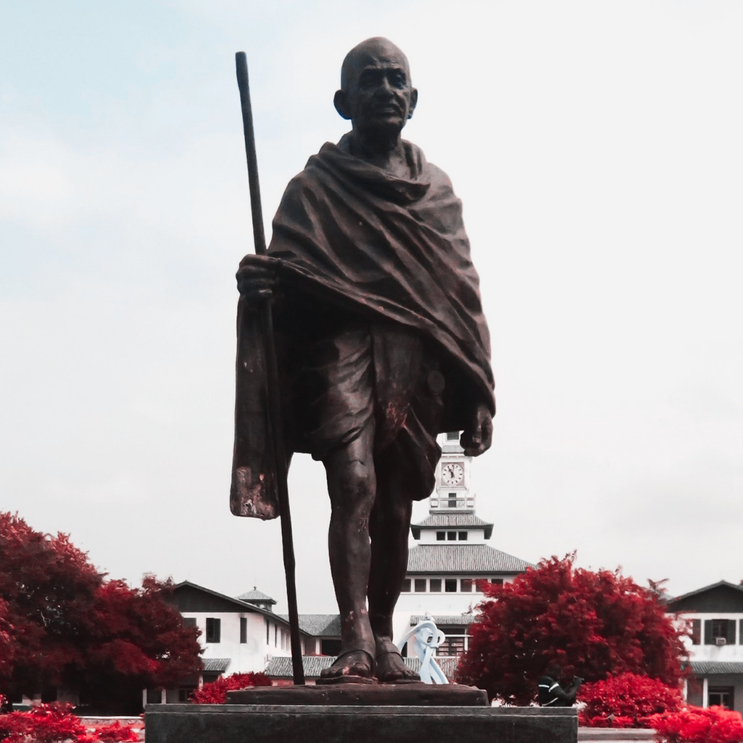 Statue of Mahatma Gandhi with staff in front of University of Ghana